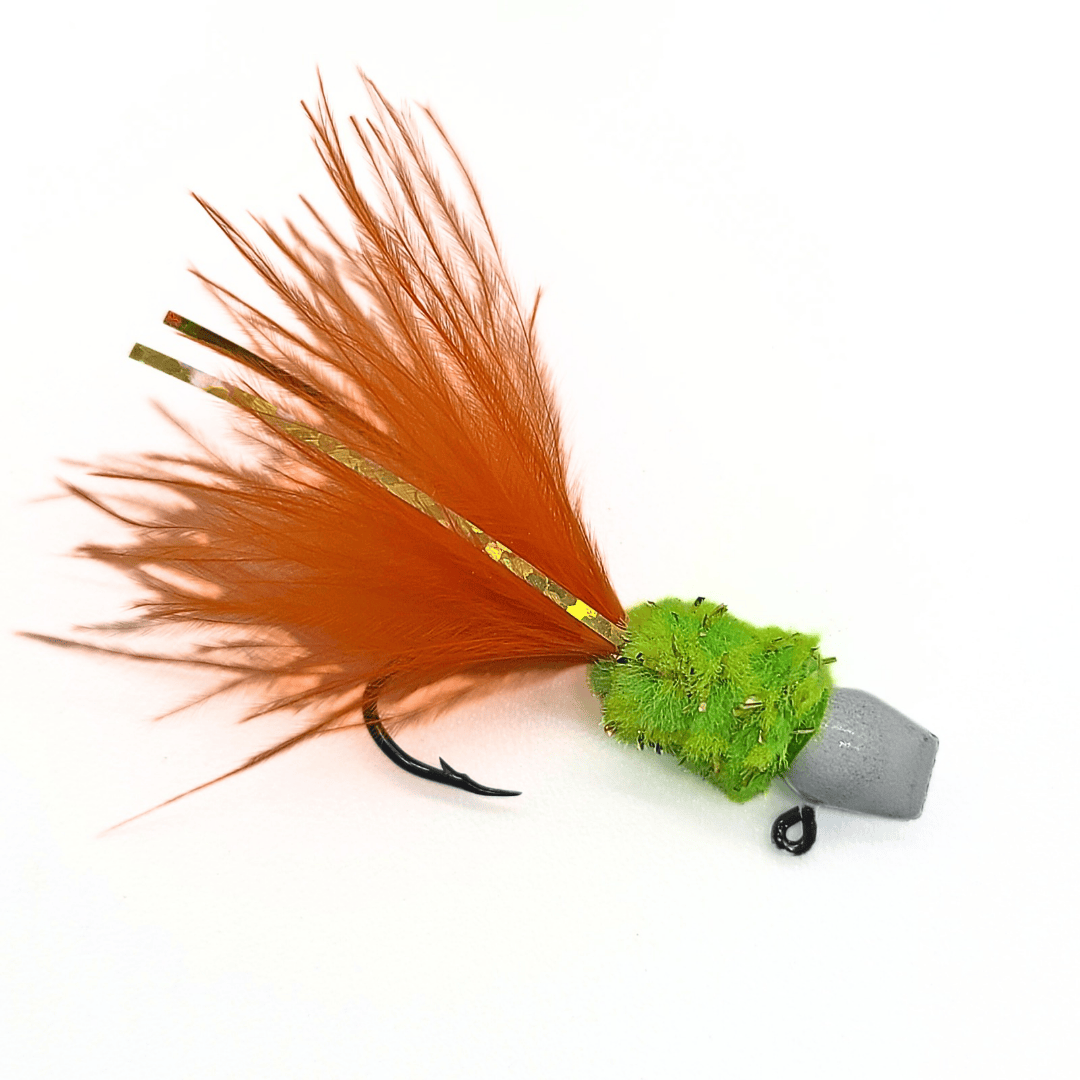 Hand tied crappie jig with a orange feather tail, a bright green sparkly body made of synthetic material, and a round white jig head. This crappie lure features a sickle hook, designed to attract fish by mimicking the appearance and movement of prey in the water, making it an effective and visually appealing bait for crappie fishing. This fishing lure is hand tied by Ramble Tamble Tackle
