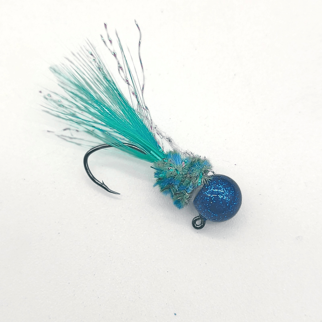 Hand-tied crappie jig with a custom painted head, soft chenille body, feathered tail, and flash accents, designed for crappie fishing.