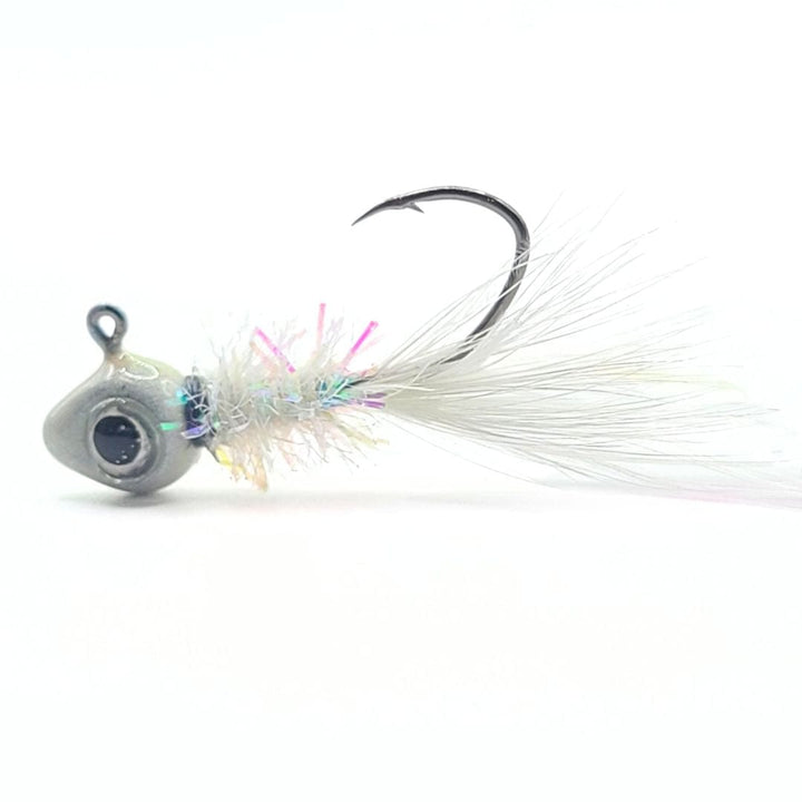 Hand tied crappie jig with a white feather tail, a sparkly body made of synthetic material in iridescent colors, and a round gray jig head. This crappie lure features a sickle hook, designed to attract fish by mimicking the appearance and movement of prey in the water, making it an effective and visually appealing bait for crappie fishing. This fishing lure is hand tied by Ramble Tamble Tackle.